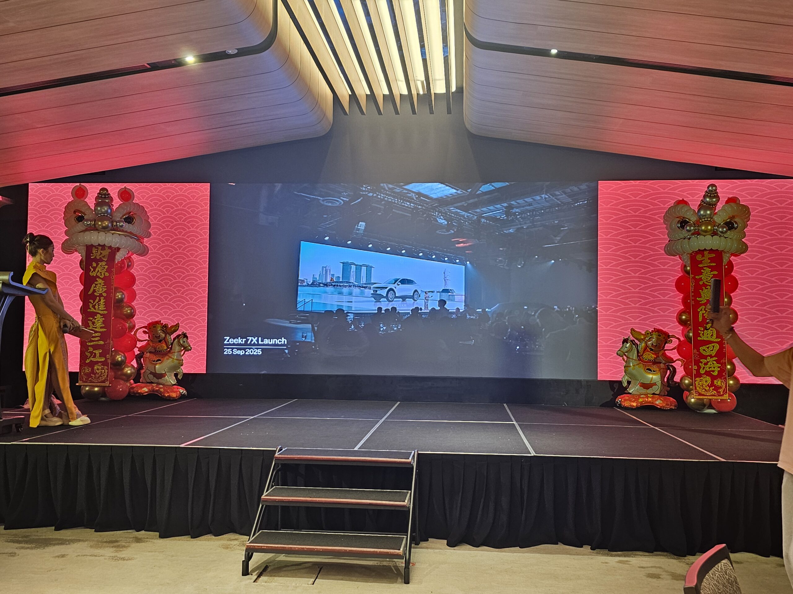 Balloon lion head Singapore CNY stage decor with God of Fortune at Zeekr launch