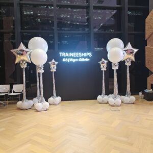 Silver balloon columns Singapore with white jumbo balloons and foil stars at corporate traineeship event