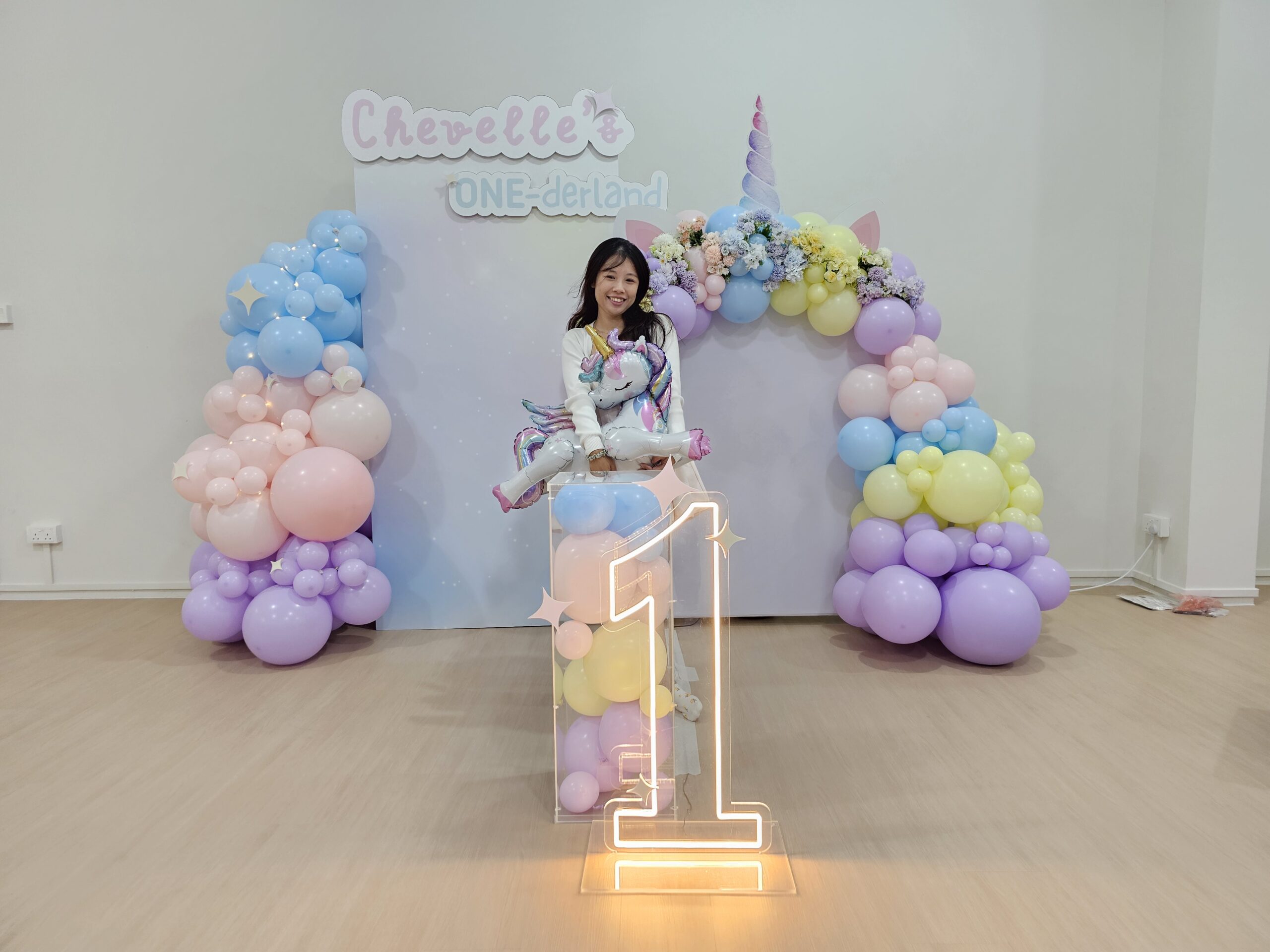 Unicorn balloon decoration Singapore complete setup with arch backdrop and glowing number 1