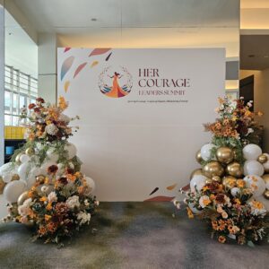 White and gold event balloon decoration Singapore for Her Courage Leaders Summit backdrop